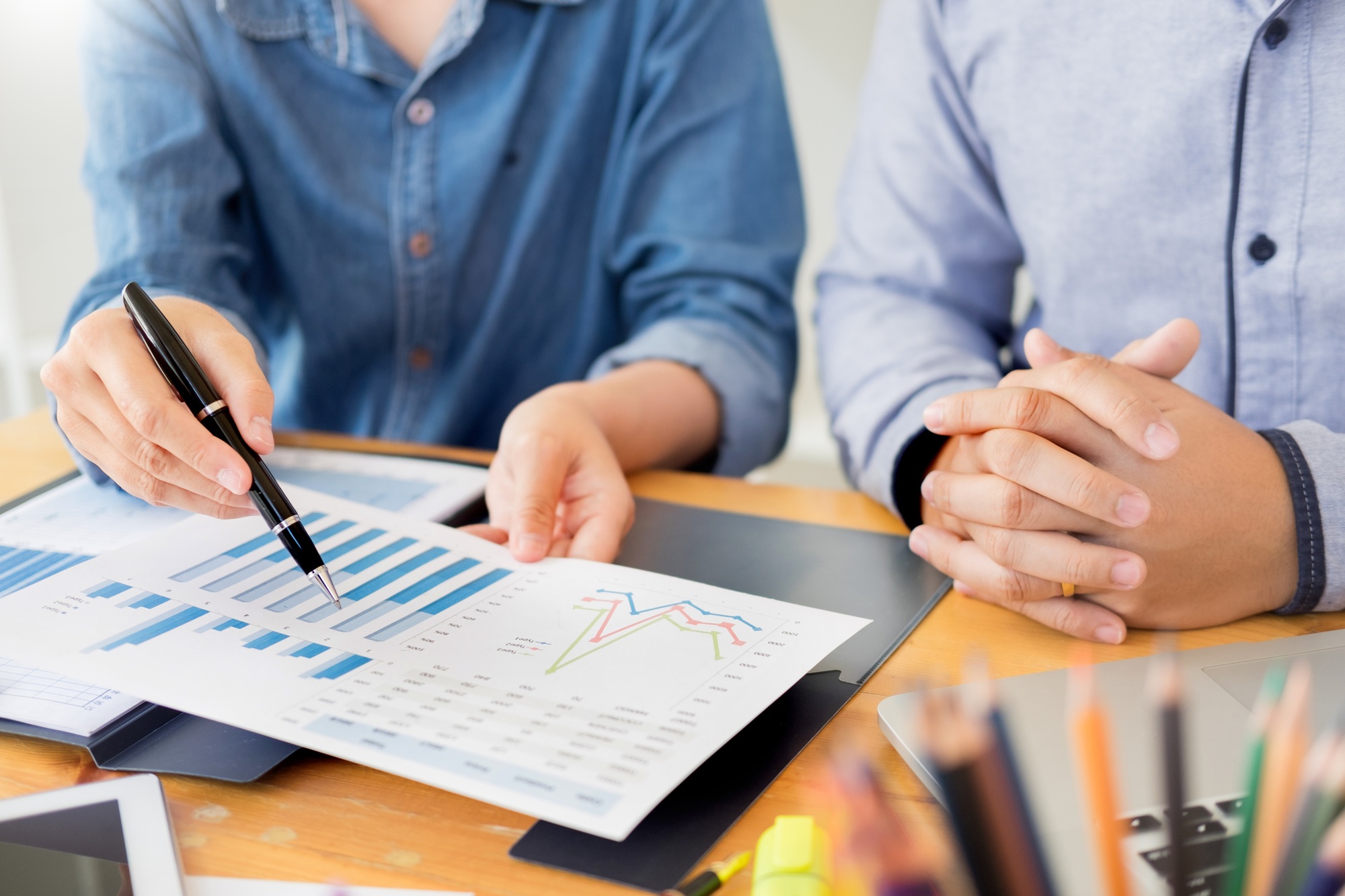 Startup Teamwork Brainstorming Meeting with Graph Planning strategy and financial plan to